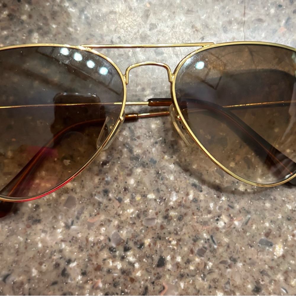 Ray-Ban Sunglasses: gold and brown aviators. Comes with case and cleaning cloth.